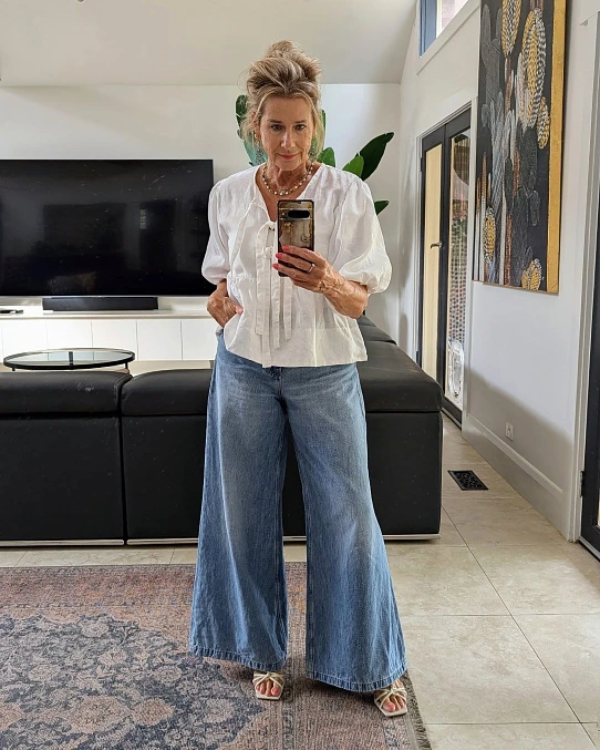 White blouse with wide-leg denim stylish outfit for women over 50