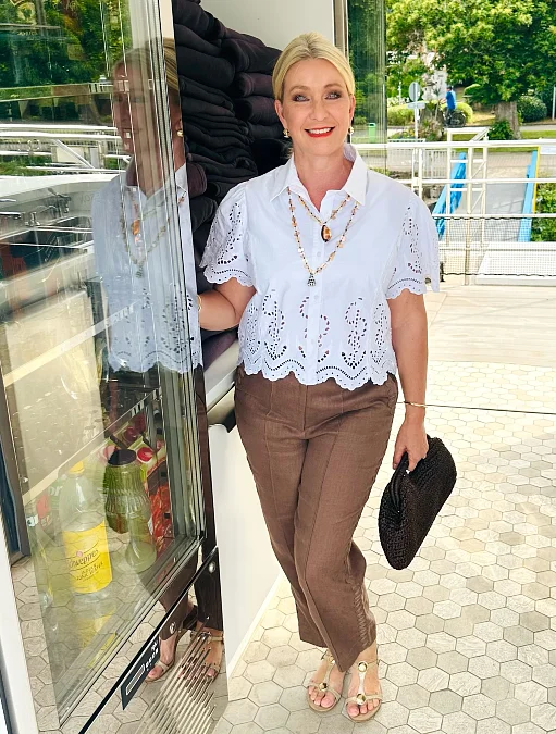 White eyelet shirt with brown pants stylish outfit for women over 50