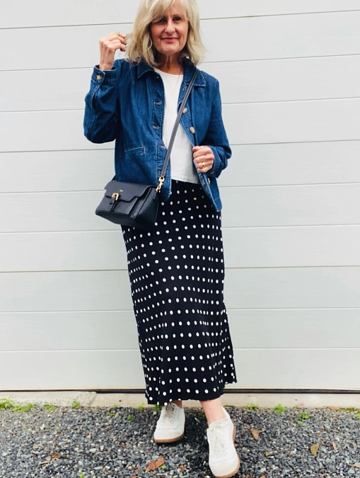 Denim jacket with polka dot midi skirt stylish outfit for women over 50
