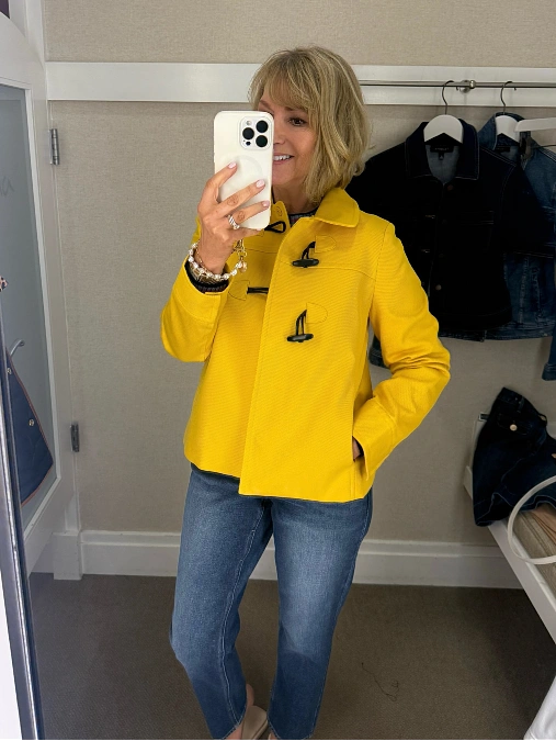 Yellow toggle jacket with straight jeans cute outfit for women over 50