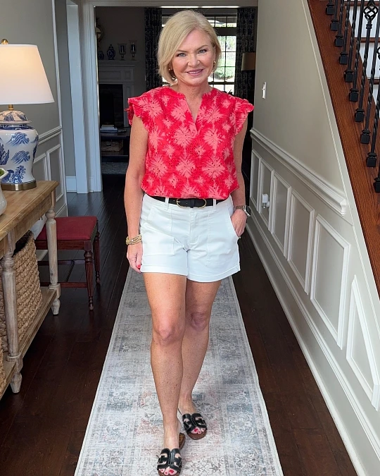 Coral blouse with white cuffed shorts cute summer outfit for women over 50
