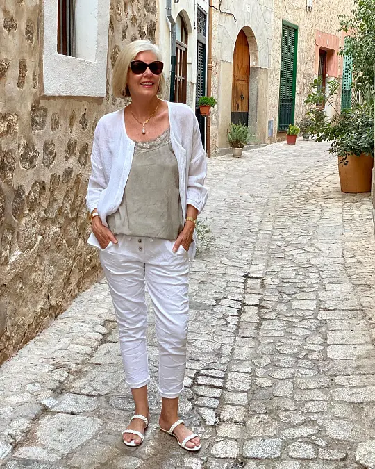 White linen shirt and cropped pants travel outfit for women over 50