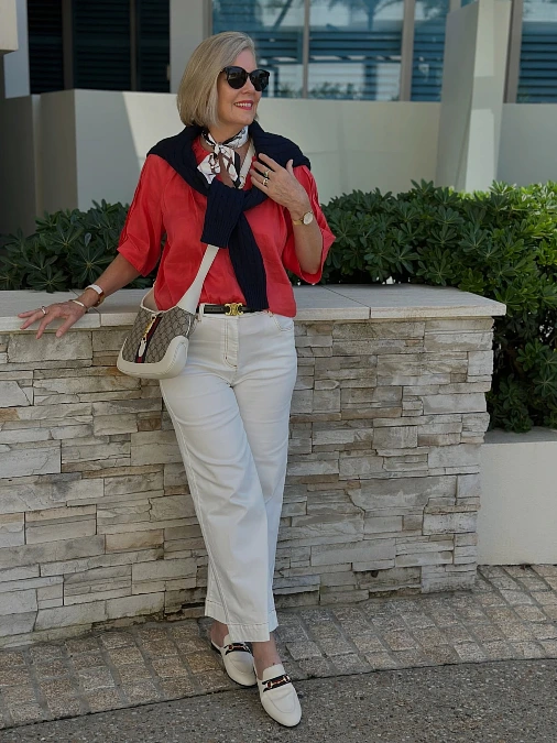 Coral blouse with cream wide-leg trousers cute outfit for women over 50