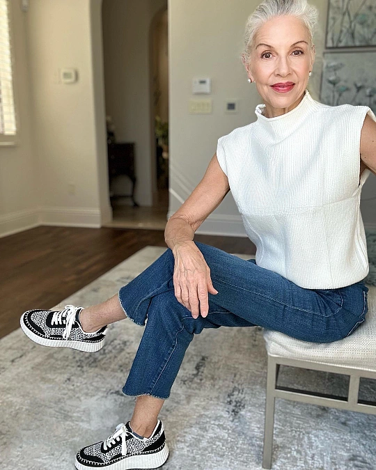 Sleeveless knit and cropped jeans casual outfit for women over 50