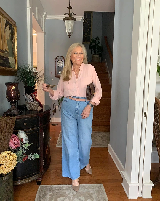 Blush blouse and wide-leg jeans trendy outfit for women over 50