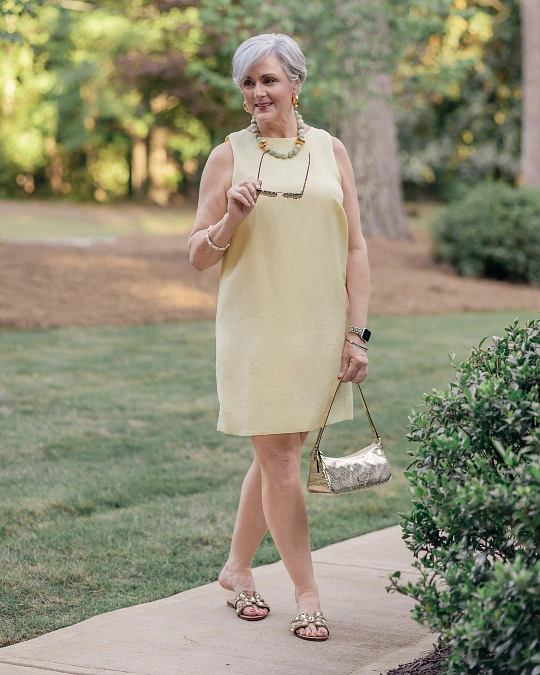 Soft yellow shift dress trendy outfit for women over 50