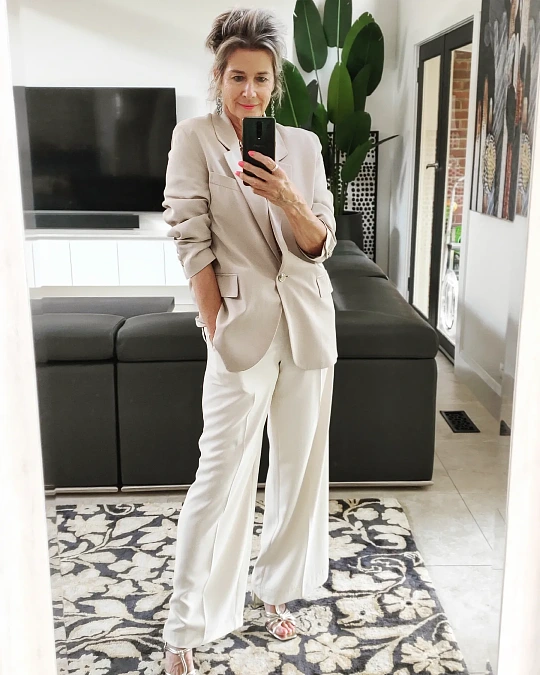 Neutral blazer and wide-leg pants trendy outfit for women over 50