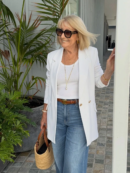 White blazer ribbed tee and wide-leg jeans outfit for women over 50