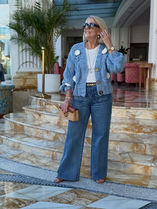 Chunky blue cardigan with white tee and wide-leg jeans outfit for women over 50