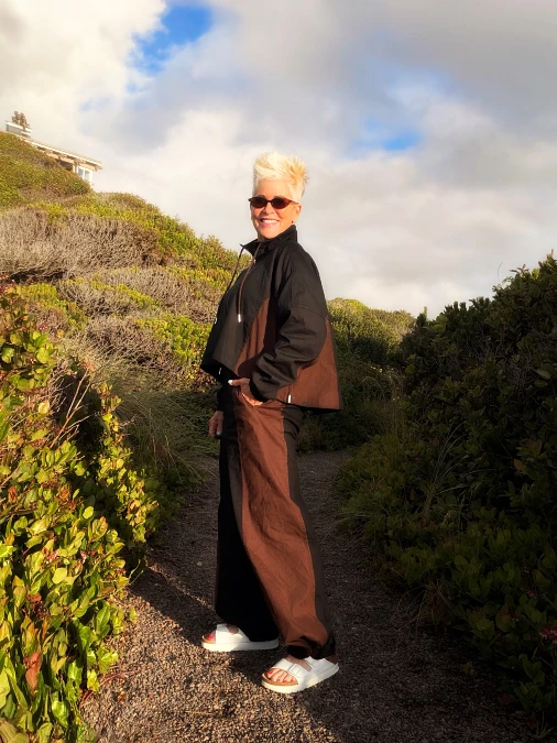 Chocolate brown layers with wide-leg pants hiking outfit for women over 50