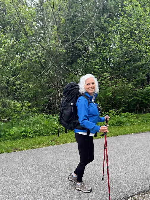 Blue trail jacket and black hiking leggings outfit for women over 50