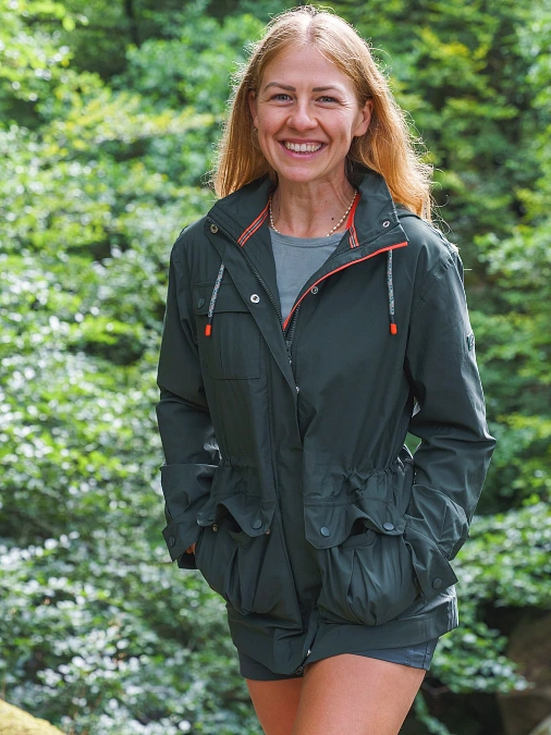 Forest green jacket and hiking shorts outfit for women over 50
