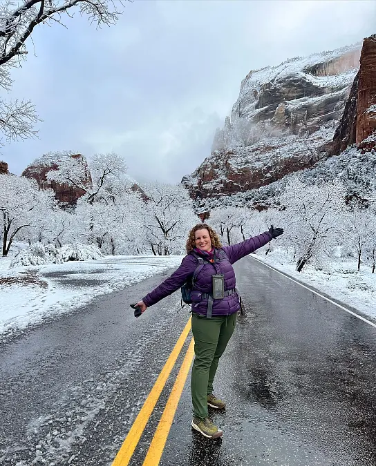 Purple puffer and olive trail pants hiking outfit for women over 50