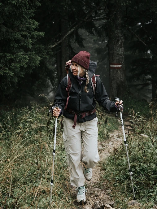 Black shell cargo pants and trail shoes hiking outfit for women over 50
