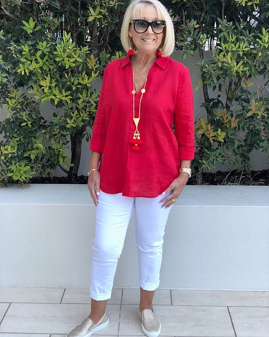 Bright red linen tunic with white jeans casual outfit for women over 50