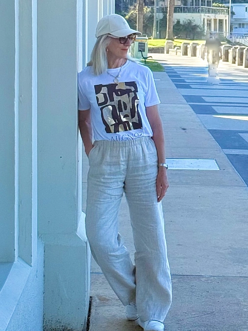 White graphic tee and oatmeal linen pants everyday outfit for women over 50