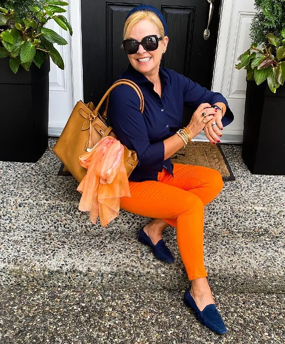 Navy button-down with bright orange cropped pants outfit for women over 50
