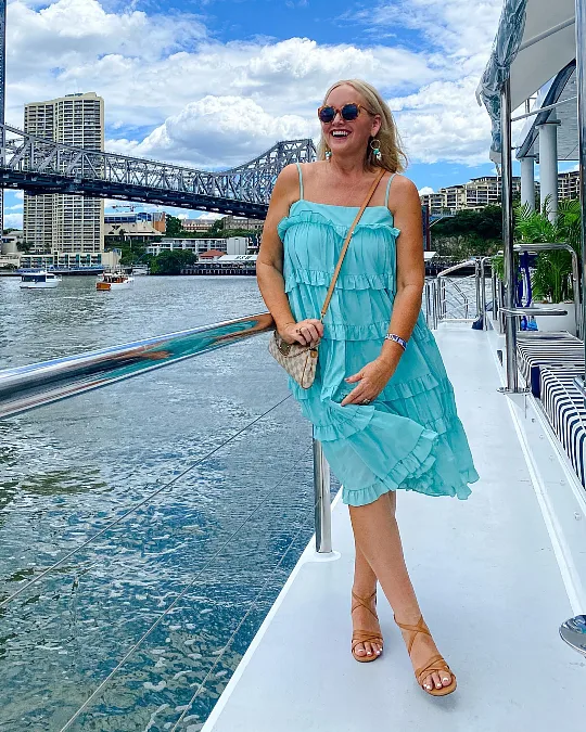Aqua ruffle sundress with tan sandals simple summer outfit for women over 50