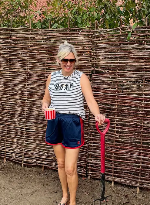 Striped tank and navy sporty shorts simple outfit for women over 50