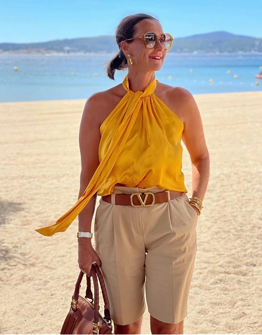 Yellow halter top and beige Bermuda shorts simple outfit for women over 50