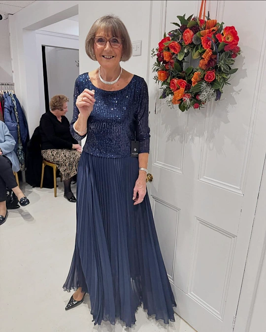Navy sequin top and pleated skirt Christmas outfit for women over 50