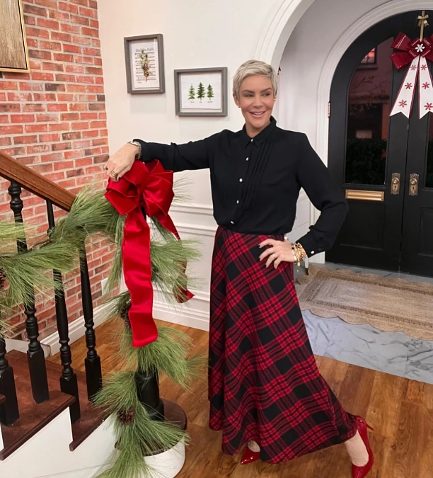 Black blouse and red plaid skirt Christmas outfit