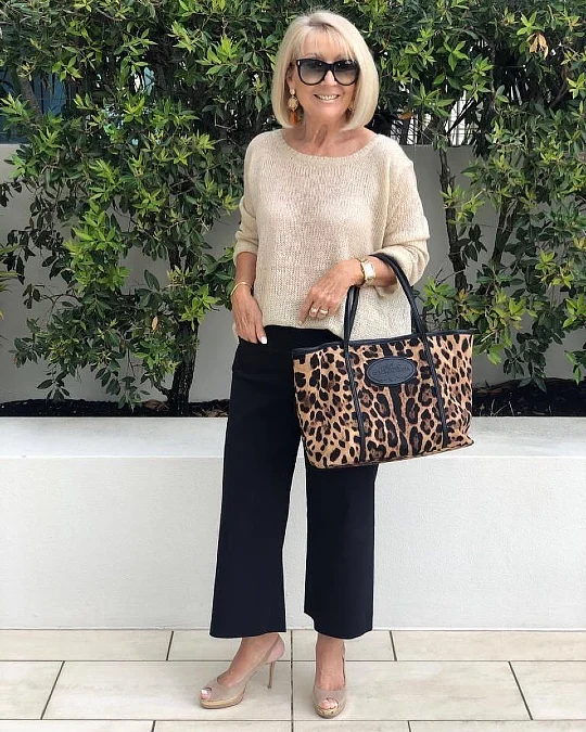 Beige knit cropped black trousers and leopard tote fall outfit