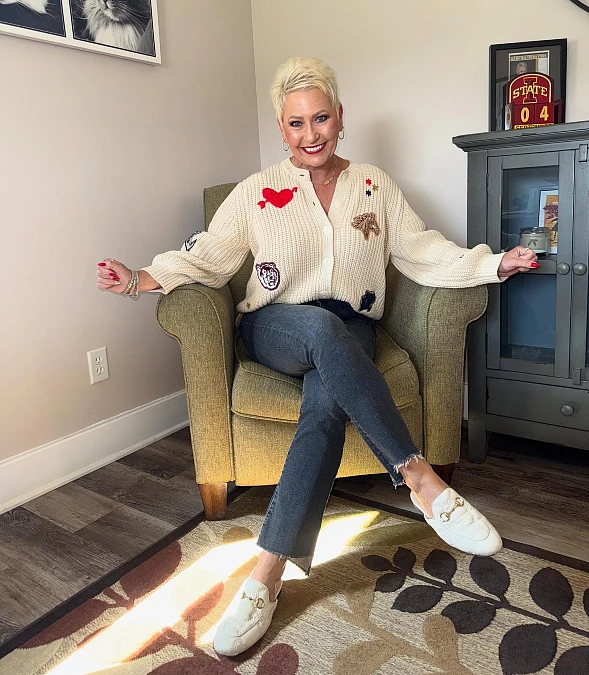 Cream cardigan and dark denim fall outfit for women over 50