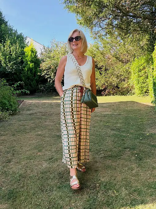 Cream knit with checked wide-leg pants Thanksgiving outfit