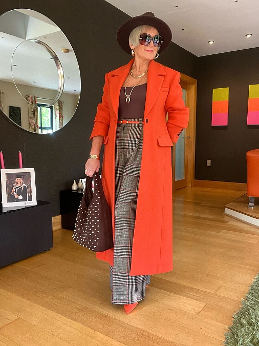 Orange coat with plaid trousers Thanksgiving outfit