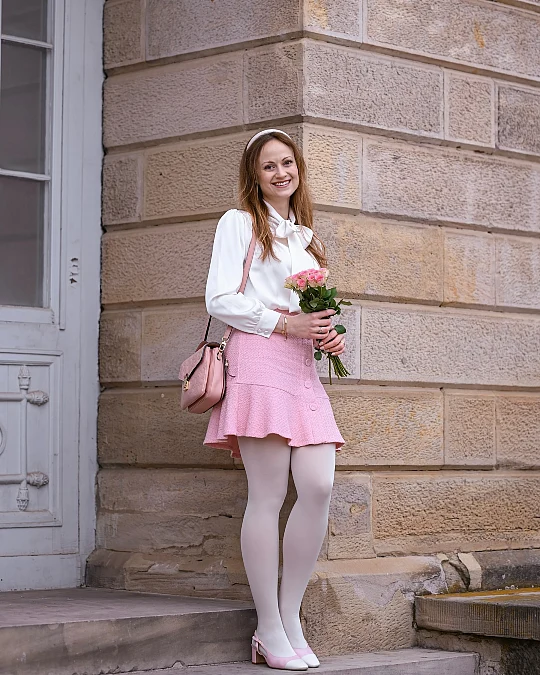 Bow blouse and pink skirt Valentine’s Day outfit for women over 50