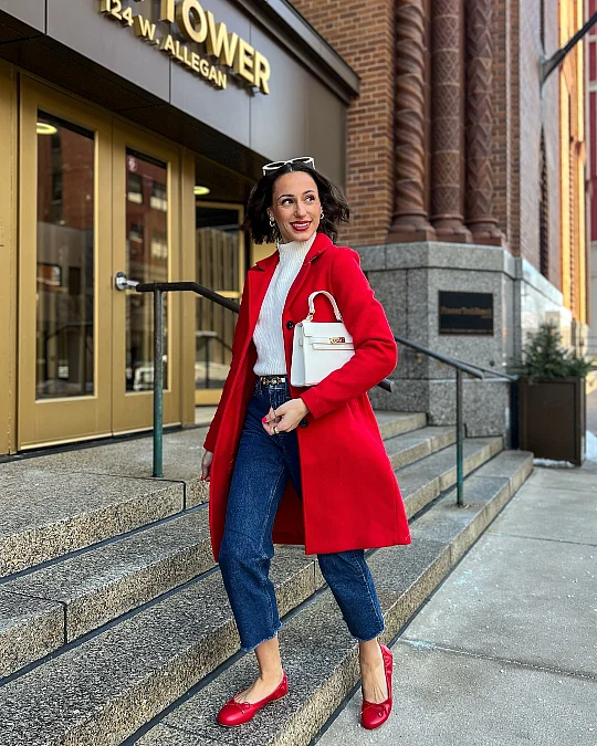 Red coat with cropped jeans Valentine’s Day outfit for women over 50
