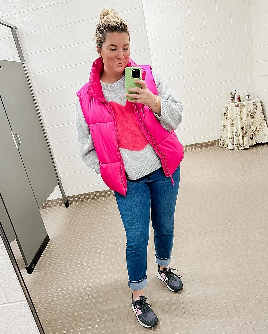 Pink puffer vest and heart knit casual Valentine’s Day outfit over 50