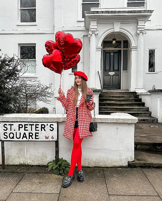 Red tights and houndstooth coat Valentine’s Day outfit for women over 50