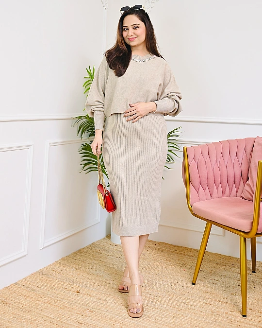 Soft beige knit with jeweled detail New Year's Eve outfit