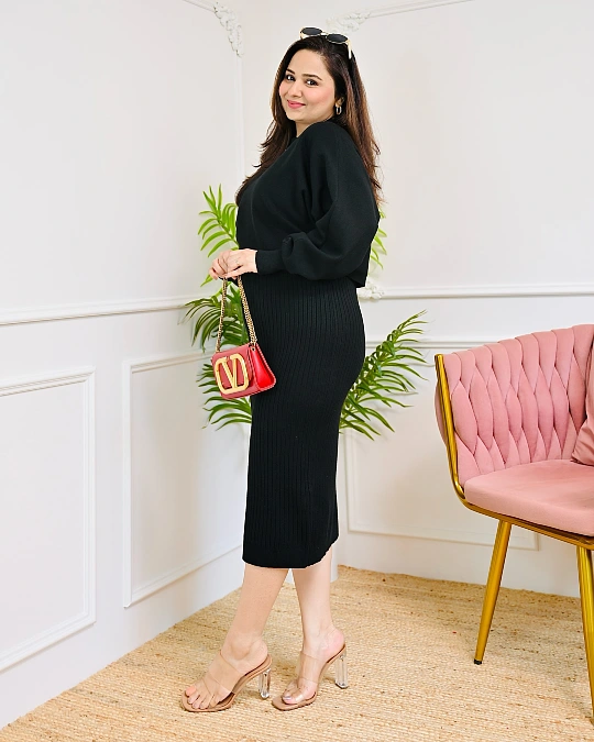 Black knit set with red accent New Year's Eve outfit
