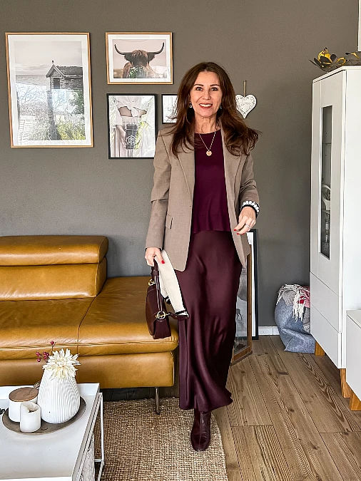 Burgundy satin skirt and taupe blazer winter work outfit for women over 50