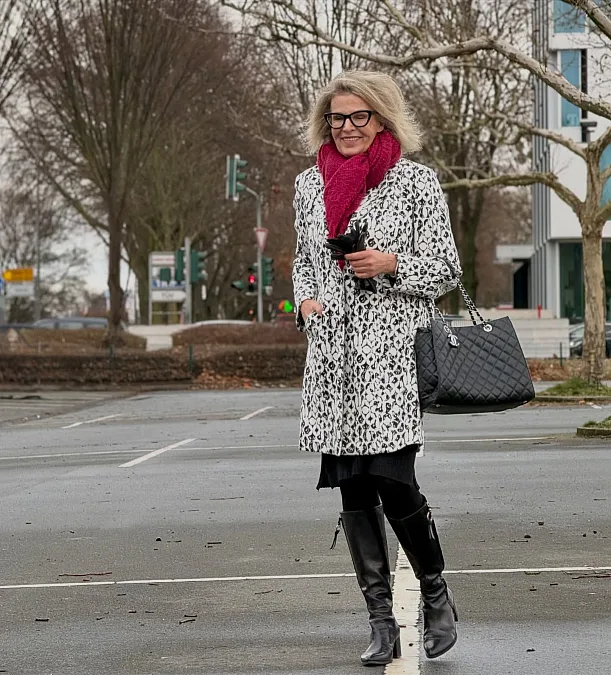 Monochrome coat and raspberry scarf winter work outfit for women over 50