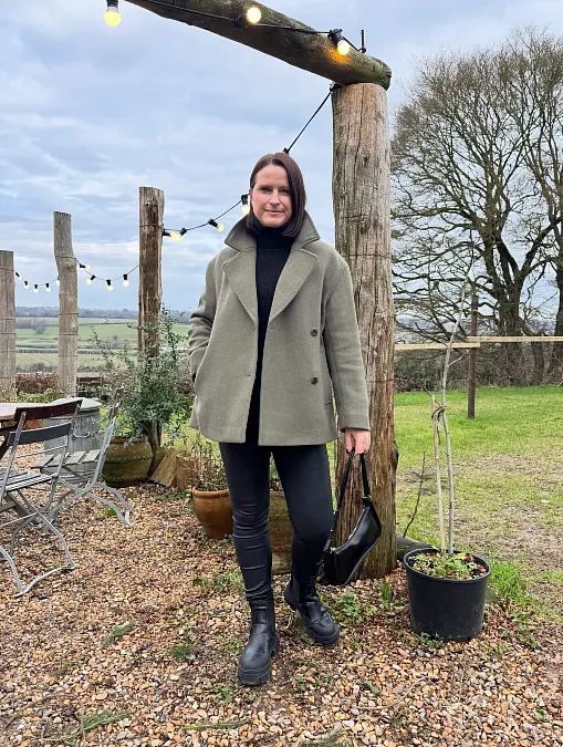 Sage coat and black winter basics outfit for women over 50