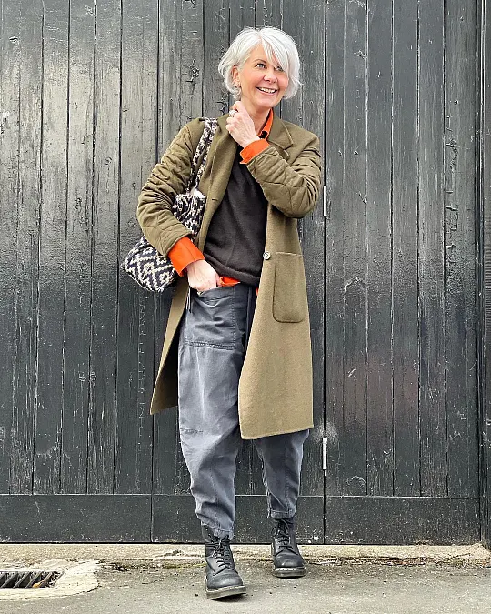 Olive coat relaxed gray trousers winter work outfit for women over 50