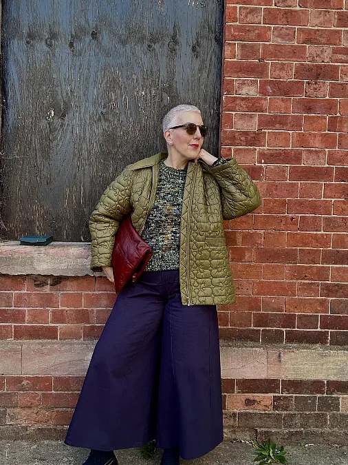 Olive quilted jacket and wide-leg trousers winter work outfit for women over 50