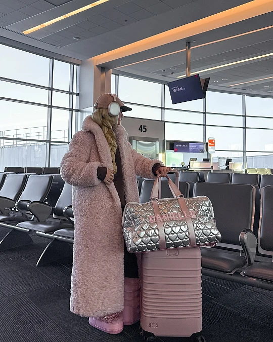 Plush pink airport layers for snowbird travel over 50