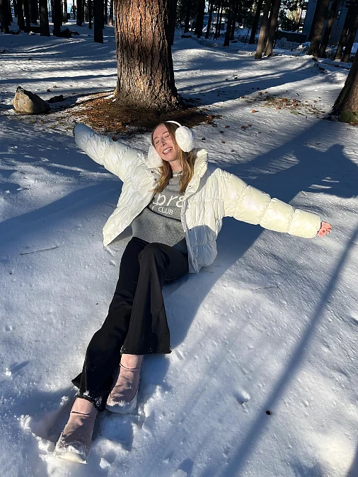 Ivory puffer and black flared pants snowbird outfit over 50