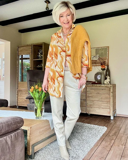 Printed shirt and cream trousers holiday outfit for women over 50