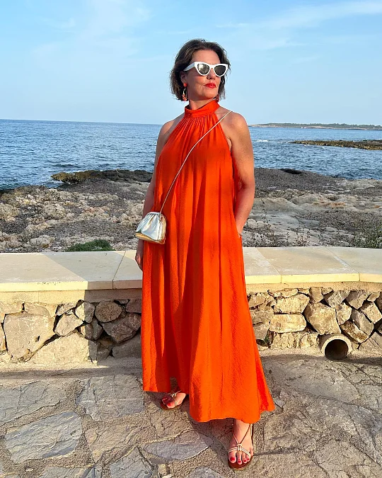 Bold orange halter holiday dress for women over 50