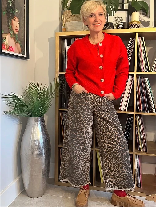 Red cardigan and leopard trousers autumn outfit for women over 50