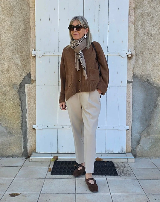 Chocolate cardigan and cream trousers fall outfit for women over 50