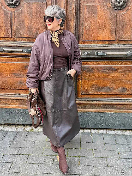 Chocolate leather skirt and bomber jacket autumn outfit for women over 50