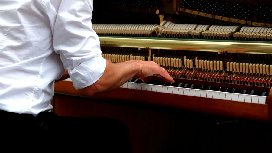 Older adult playing a musical instrument instead of saving it for someday
